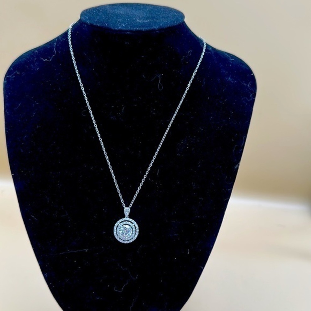Beautiful diamond”ish” necklace. No one will know. Silver 9” chain.